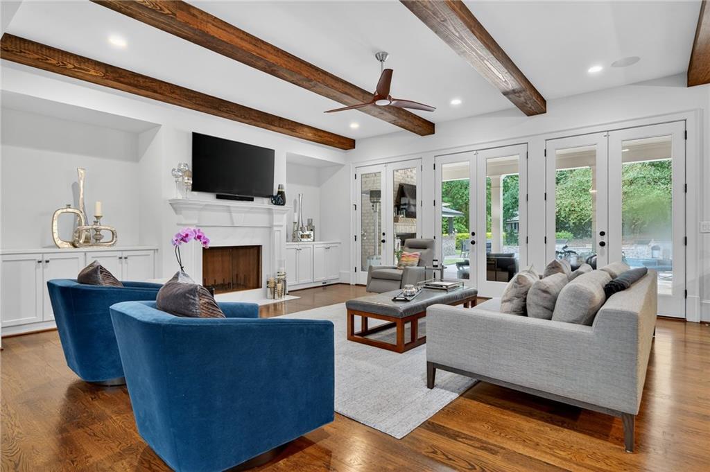 976 Ferncliff Road Northeast Atlanta, GA 30324 - Photo 3 of 58 a living room with fireplace furniture and a flat screen tv