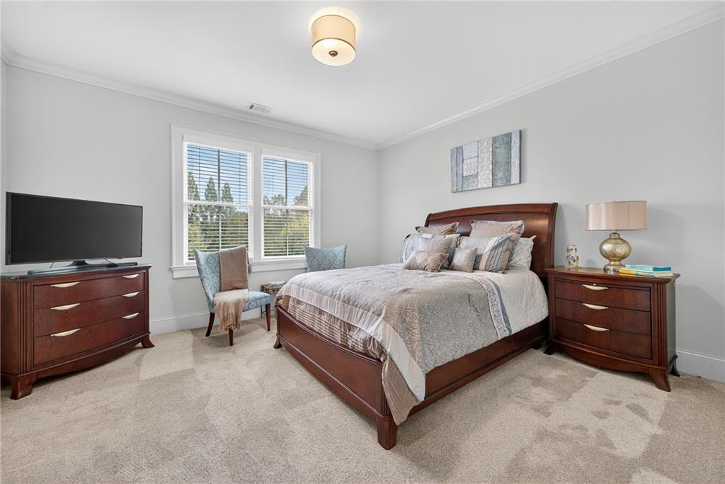 976 Ferncliff Road Northeast Atlanta, GA 30324 - Photo 34 of 58 a bedroom with a bed and a window