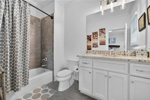 a view of a living room with wooden floor