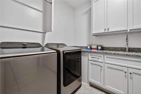 a room with lots of furniture and wooden floor