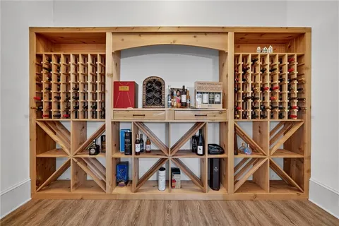 a kitchen with granite countertop kitchen island and chairs in it