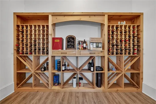 a kitchen with granite countertop kitchen island and chairs in it