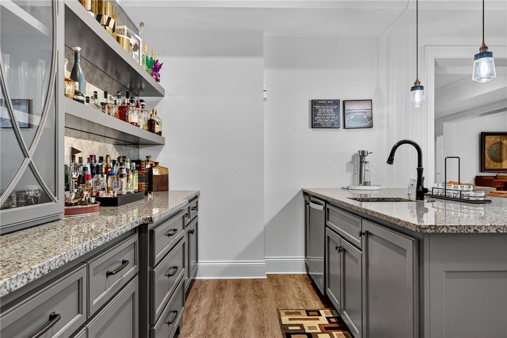 976 Ferncliff Road Northeast Atlanta, GA 30324 - Photo 41 of 58 a kitchen with stainless steel appliances granite countertop a sink stove and cabinets