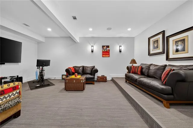 a bedroom with a bed and a couch