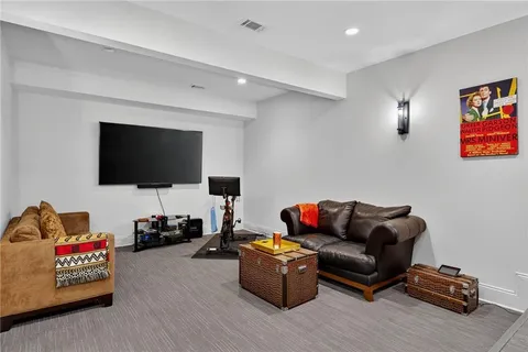 a bedroom with a bed and flat screen tv