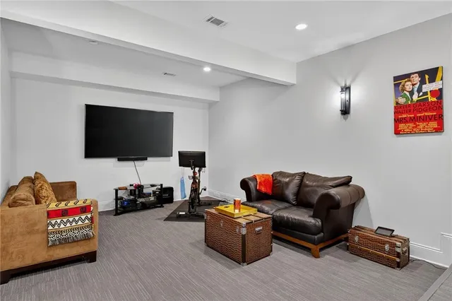 a bedroom with a bed and flat screen tv