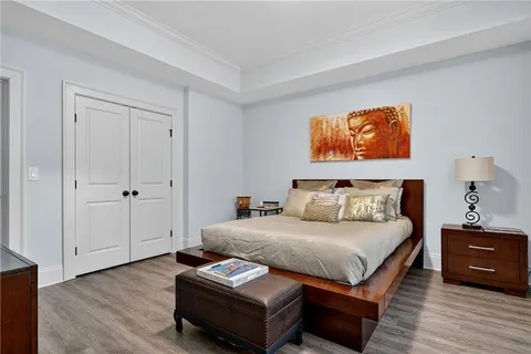 a bathroom with a granite countertop sink a toilet and a mirror