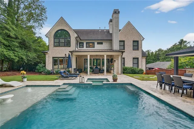 a view of a swimming pool with a patio