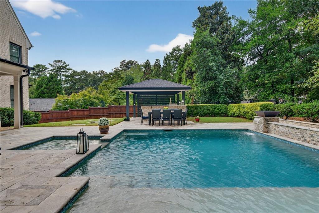 976 Ferncliff Road Northeast Atlanta, GA 30324 - Photo 53 of 58 a view of a swimming pool with a patio