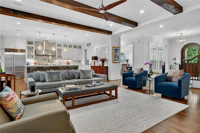 a kitchen with a sink appliances and cabinets