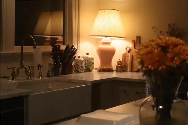 a kitchen with a sink and a refrigerator