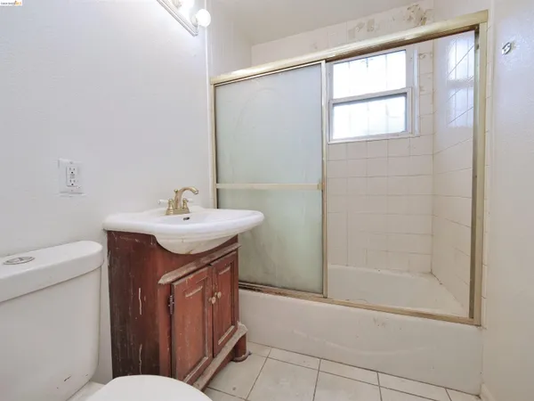 a kitchen with stainless steel appliances granite countertop a sink a stove and a microwave oven