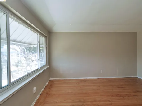 a kitchen with a refrigerator sink and cabinets