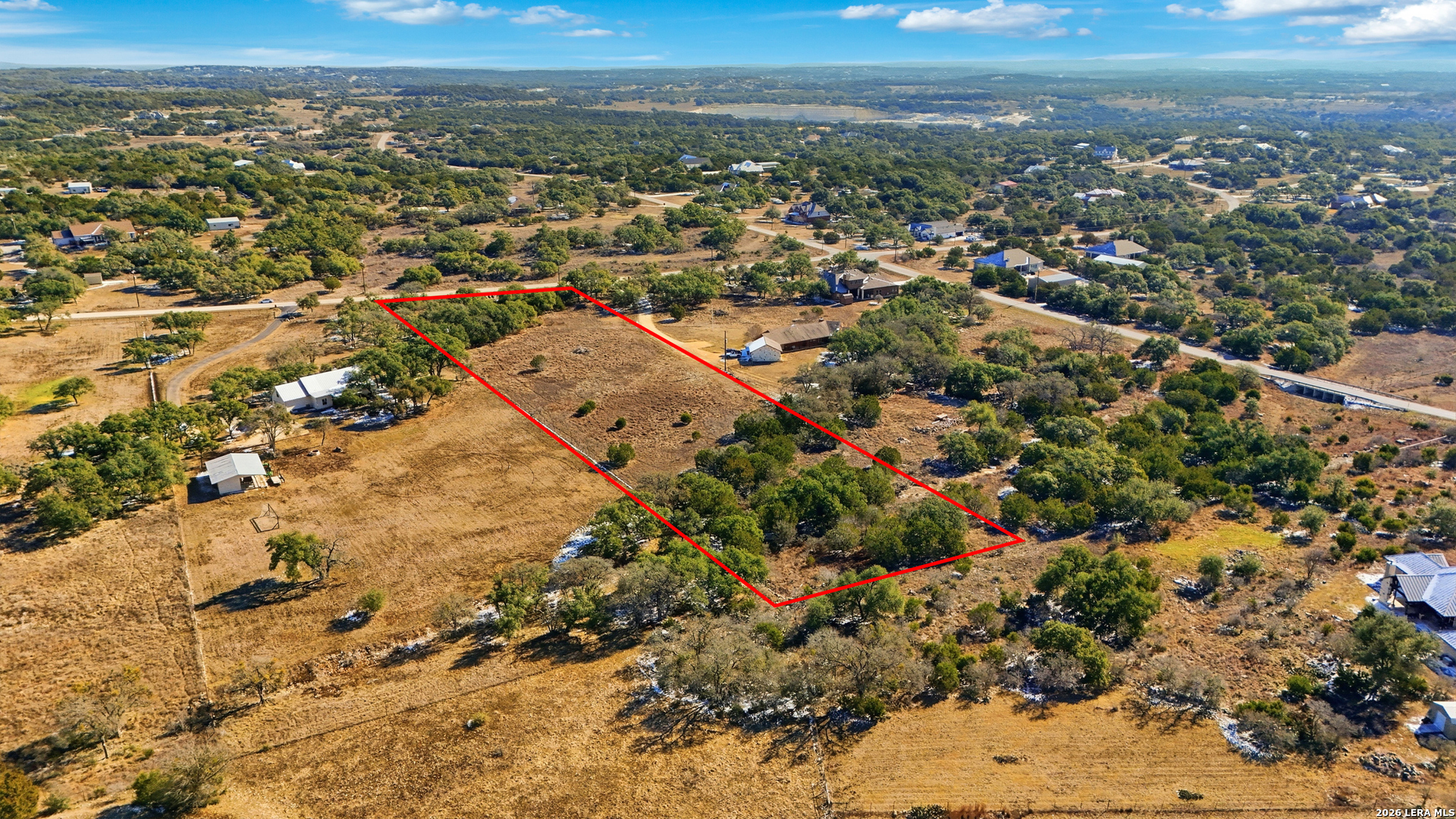 246 Dodder Lane Spring Branch, TX 78070 - Photo 13 of 22 an aerial view of residential building and trees