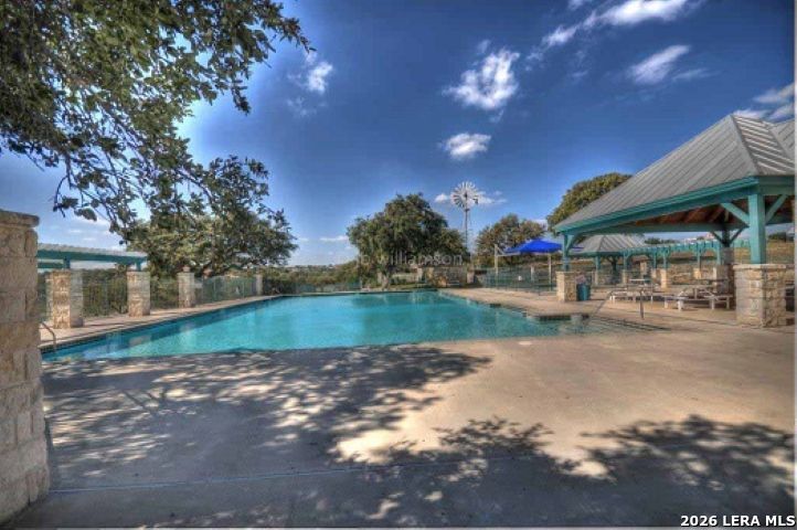 246 Dodder Lane Spring Branch, TX 78070 - Photo 20 of 22 a view of a lake with green space