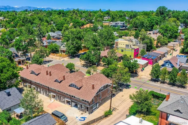an aerial view of a house with a garden