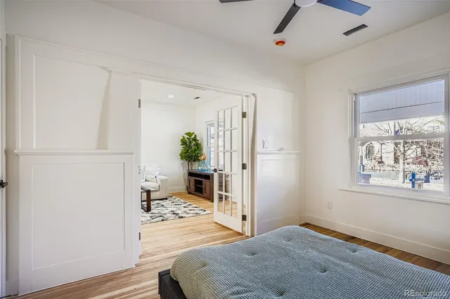 a bedroom with a bed and a window