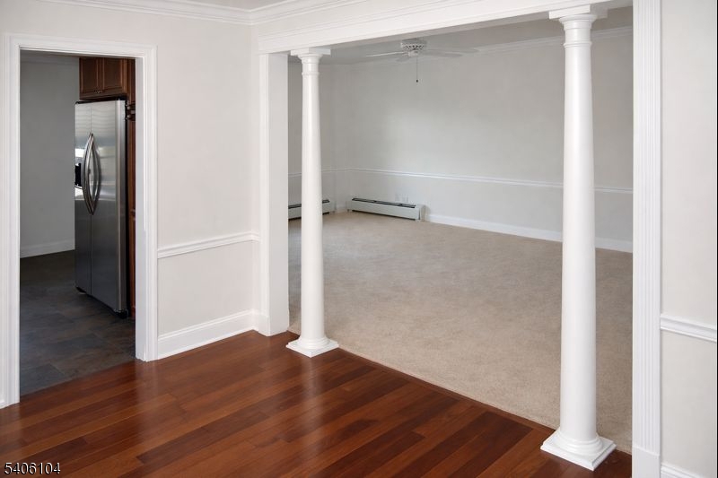 18 Springfield Avenue, Unit 4E Cranford, NJ 07016 - Photo 2 of 11 an empty room with wooden floor & closet