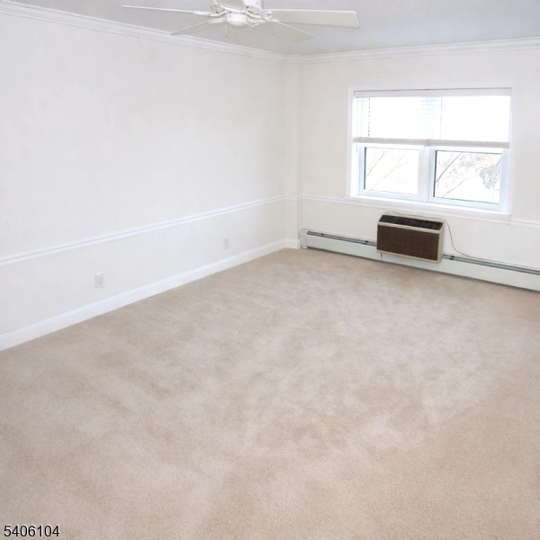 18 Springfield Avenue, Unit 4E Cranford, NJ 07016 - Photo 5 of 11 an empty room with a window