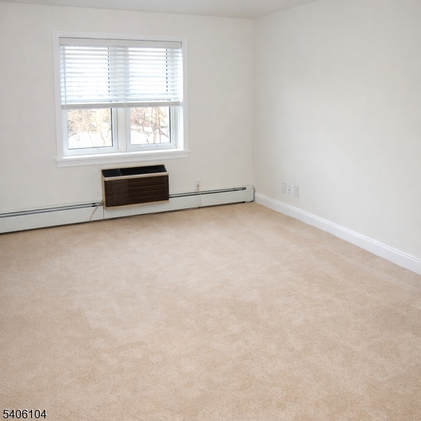 18 Springfield Avenue, Unit 4E Cranford, NJ 07016 - Photo 6 of 11 an empty room with a window