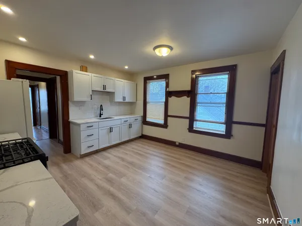 a view of kitchen and front door