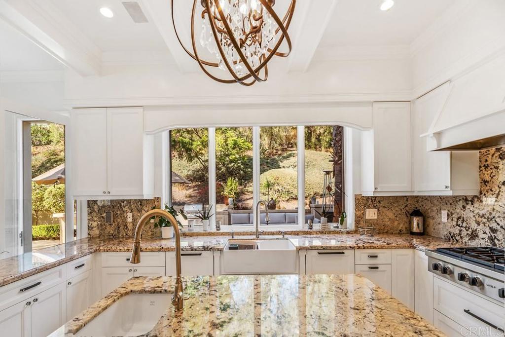 7345 Vista Rancho Court Rancho Santa Fe, CA 92091 - Photo 20 of 71 a kitchen with stainless steel appliances kitchen island granite countertop a sink and a counter space