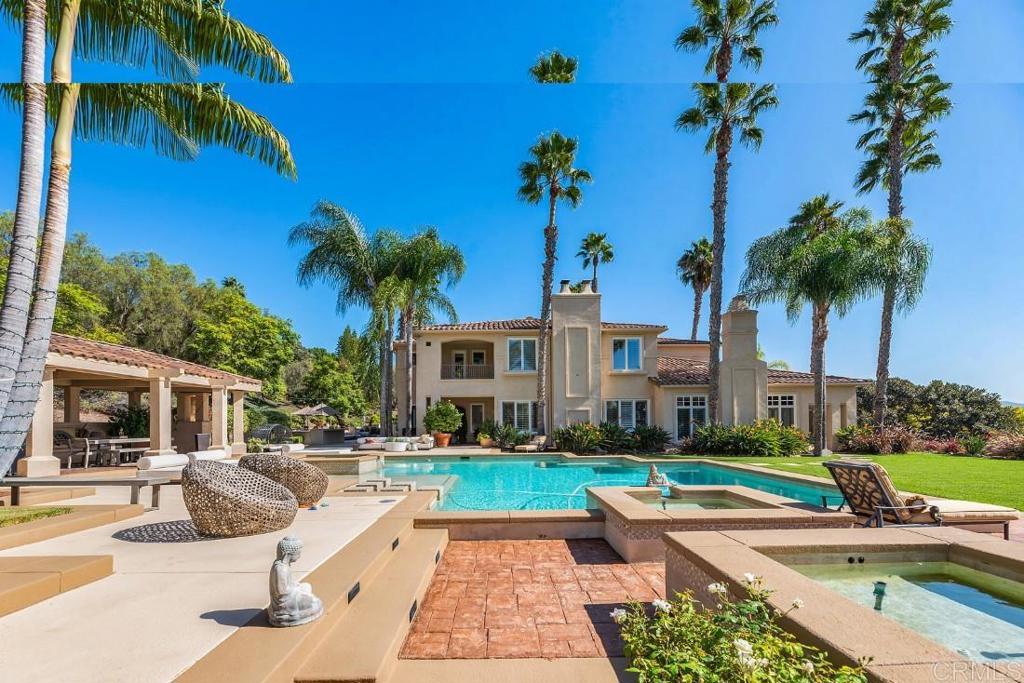 7345 Vista Rancho Court Rancho Santa Fe, CA 92091 - Photo 37 of 71 a front view of a house with swimming pool having outdoor seating