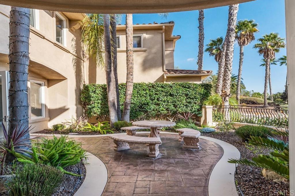 7345 Vista Rancho Court Rancho Santa Fe, CA 92091 - Photo 48 of 71 a view of a patio with couches table and chairs and potted plants