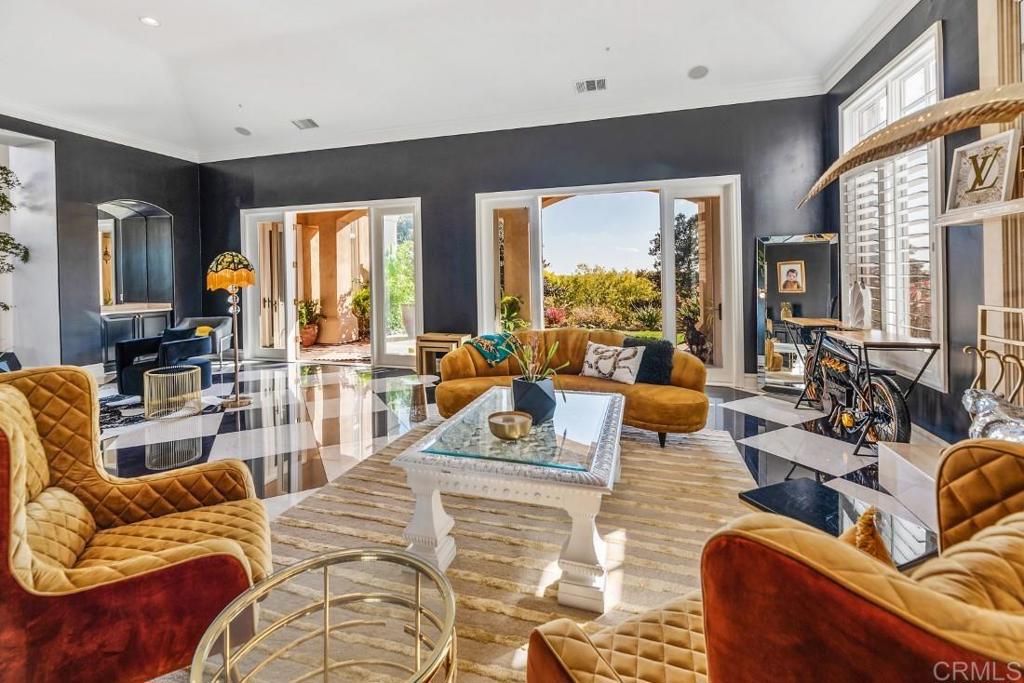 7345 Vista Rancho Court Rancho Santa Fe, CA 92091 - Photo 8 of 71 a living room with furniture and a large window