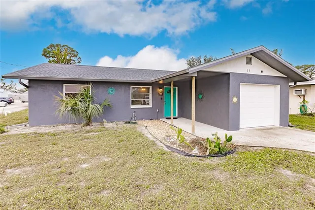 a view of a house with a yard