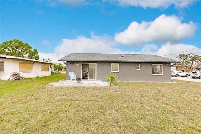 a view of a house with a yard and garage