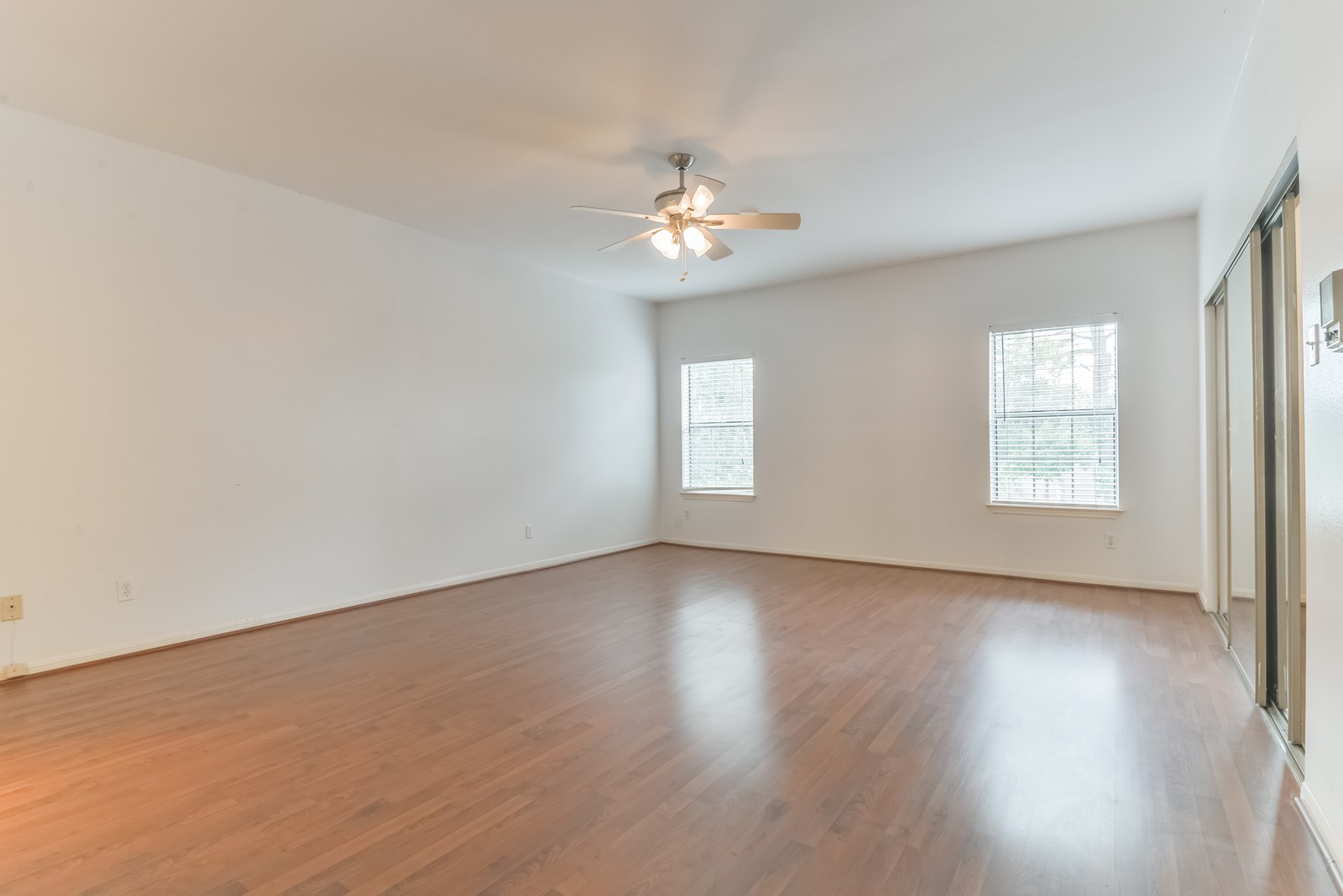 3126 Holly Hall Street Houston, TX 77054 - Photo 18 of 36 Both of the two upstairs bedrooms feature beautiful wood laminate floors, large windows for natural light, large closets and ceiling fans. Each bedroom has it's own private bathroom.
