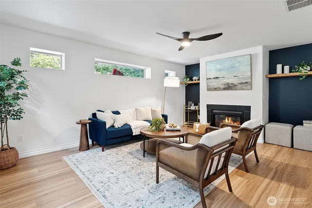 a living room with furniture and a fireplace