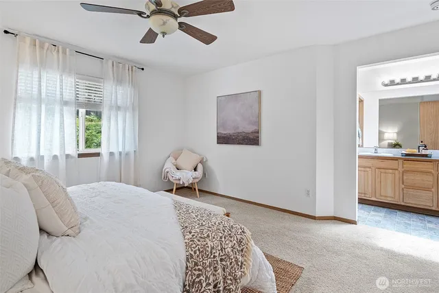 a bathroom with a toilet a sink and a mirror