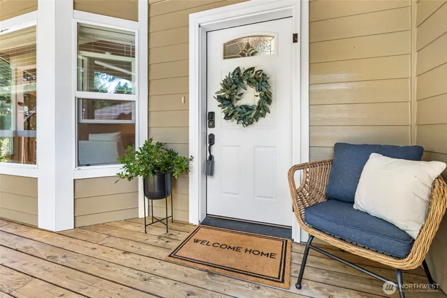 a view of a entryway with wooden floor and a potted plant