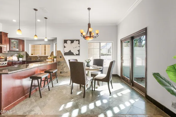 a living room with lots of furniture and a chandelier