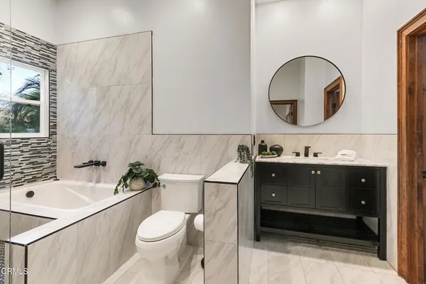 a bathroom with a shower and a sink
