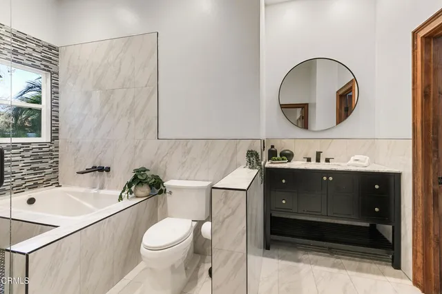 a bathroom with a shower and a sink