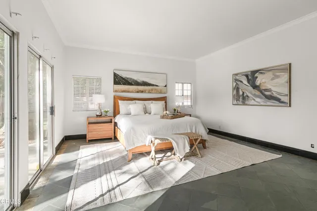 a big house with a big yard and large trees