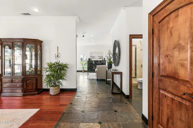 a living room with furniture fireplace and window