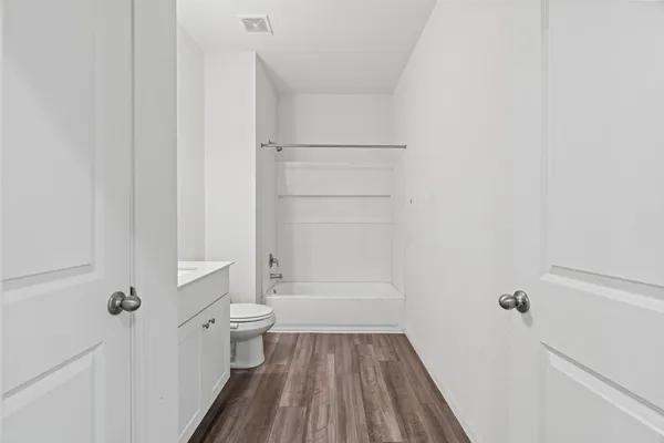 a bathroom with a sink and vanity