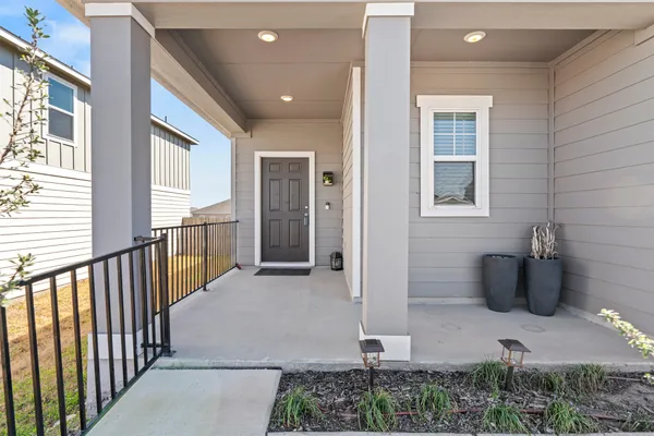 a view of a porch with wooden floor and stairs