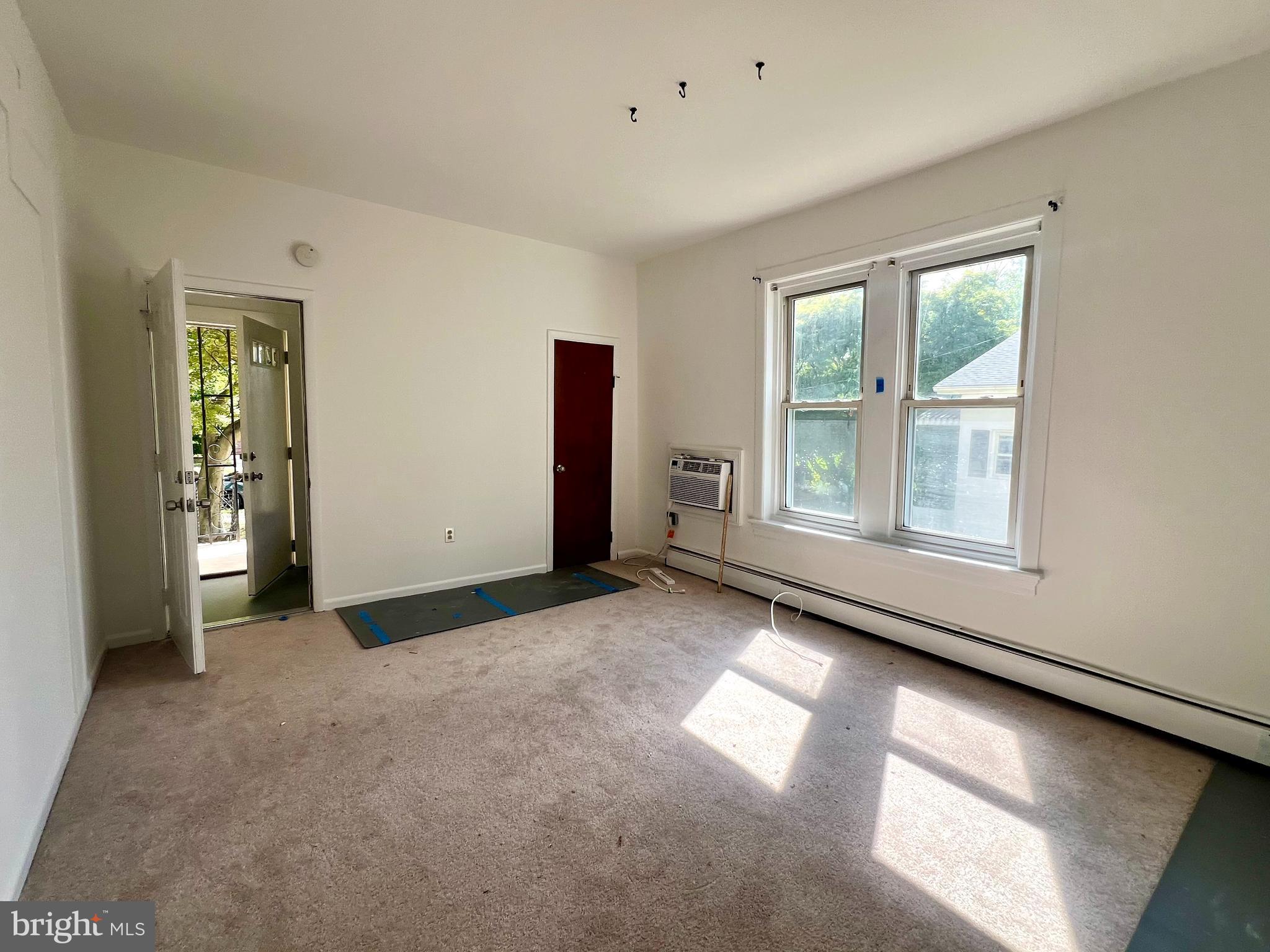 730 Richey Avenue, Unit 1 Oaklyn, NJ 08107 - Photo 2 of 11 an empty room with windows