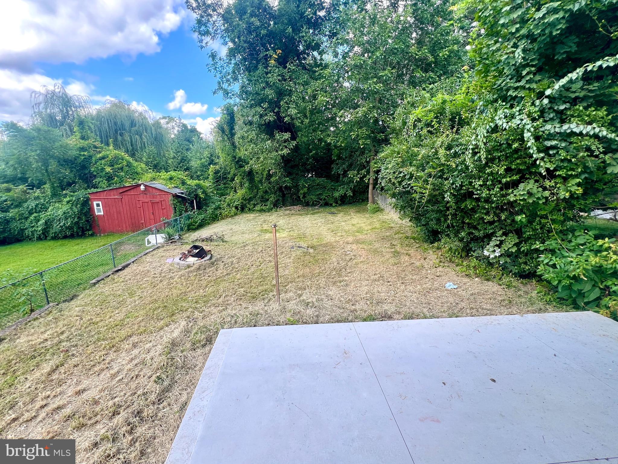 730 Richey Avenue, Unit 1 Oaklyn, NJ 08107 - Photo 8 of 11 a view of a yard with an trees