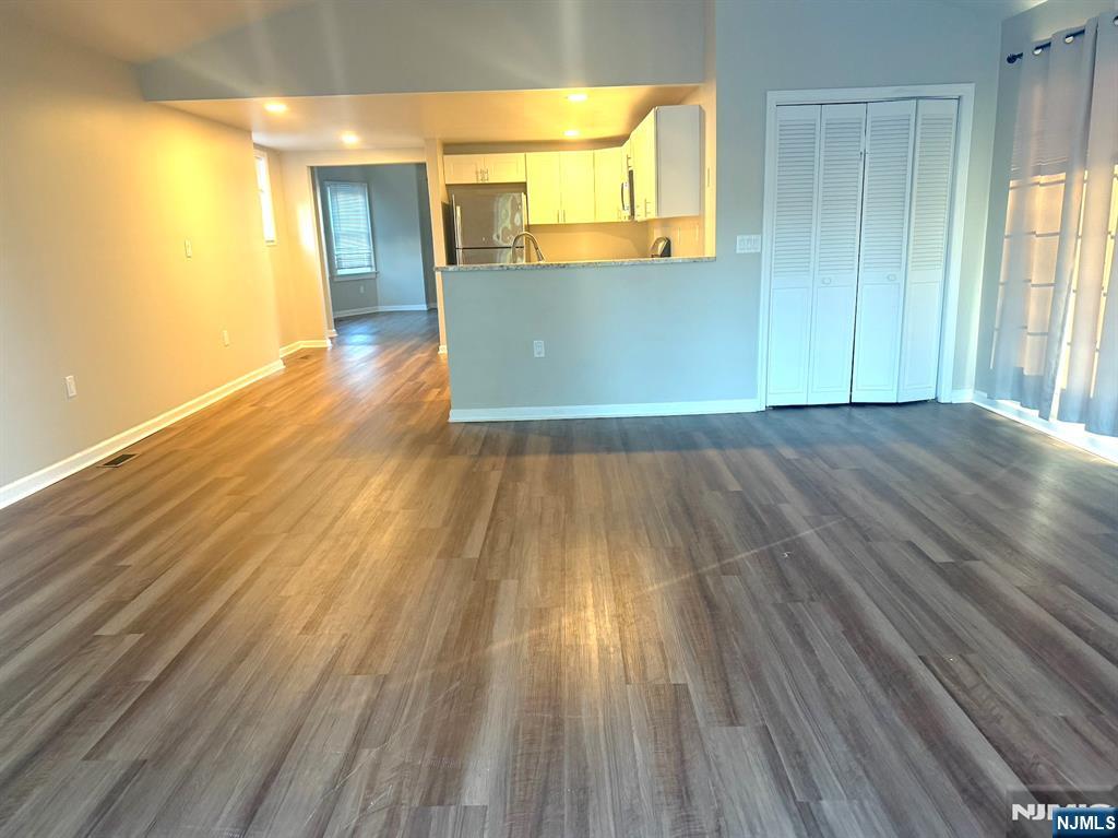 314 3rd Street Dunellen, NJ 08812 - Photo 9 of 15 wooden floor in an empty room with a window