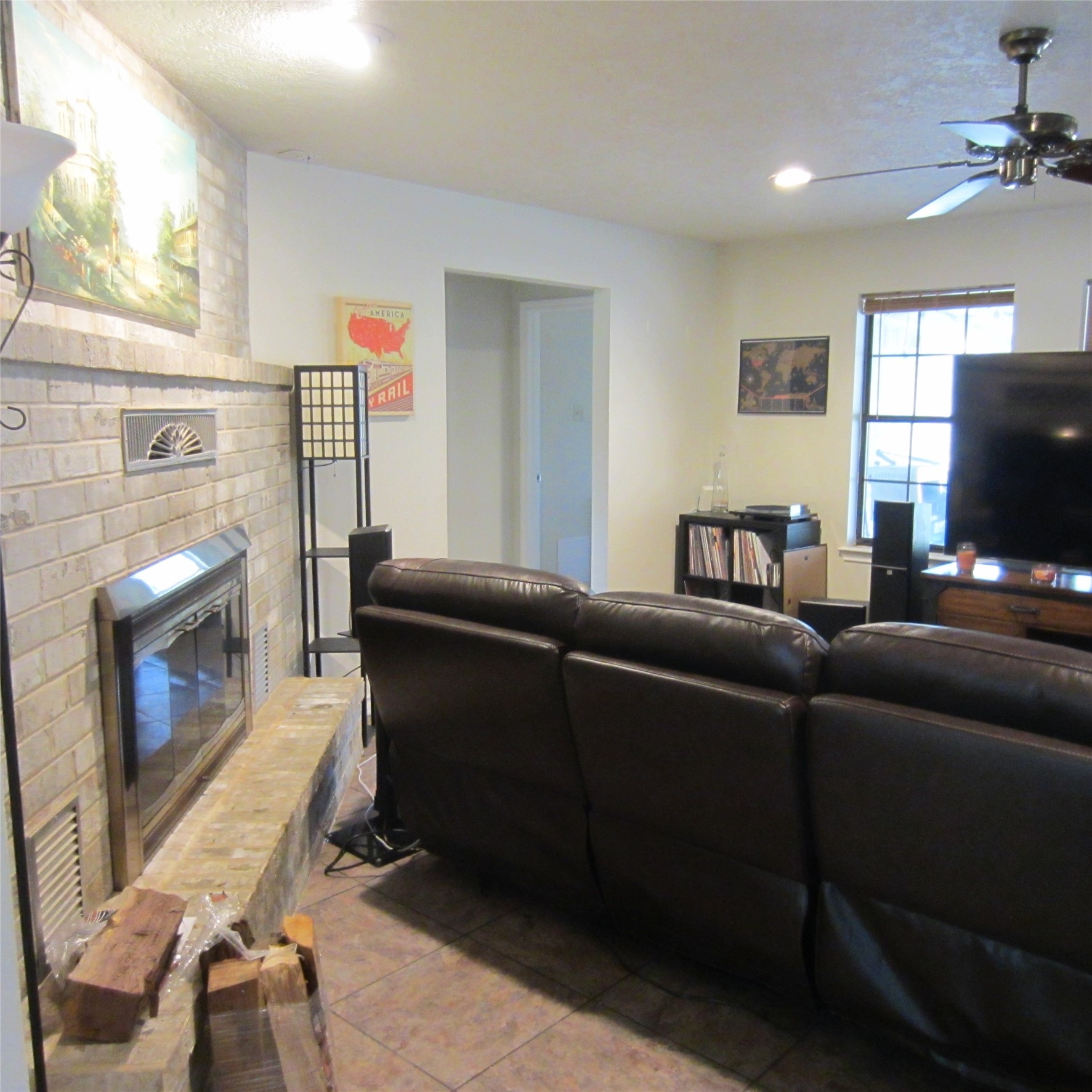 512 County Road 2222 Cleveland, TX 77327 - Photo 23 of 41 Nice fireplace in the living room.