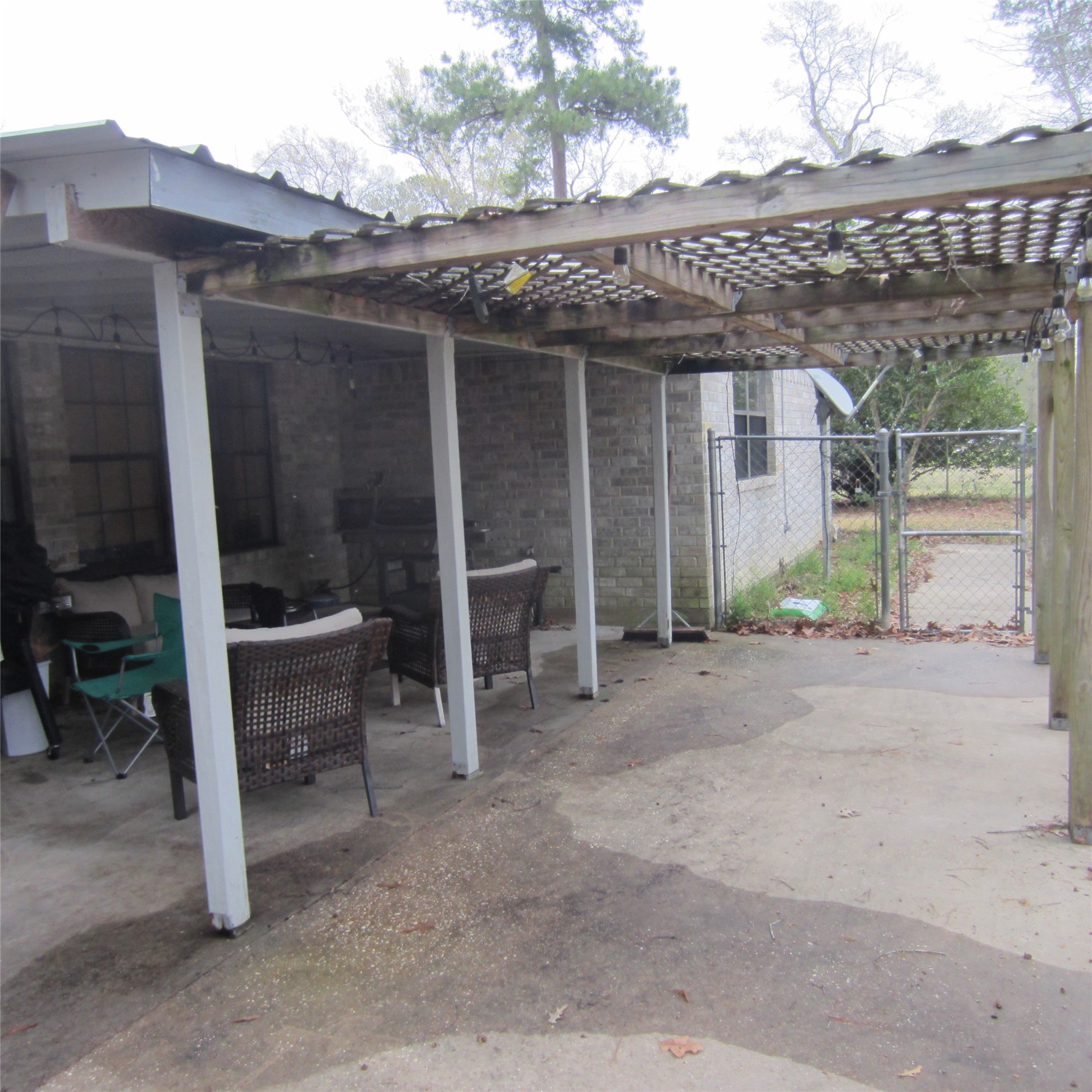 512 County Road 2222 Cleveland, TX 77327 - Photo 35 of 41 Pergola beyond the covered back porch.