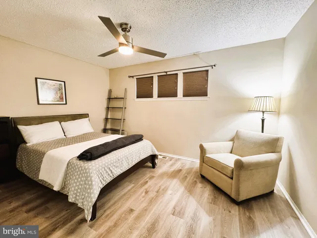 a bedroom with a bed and a walk in closet