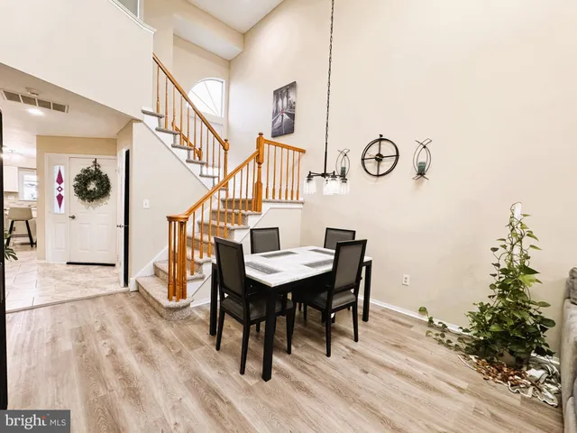 a kitchen with stainless steel appliances a refrigerator sink and stove