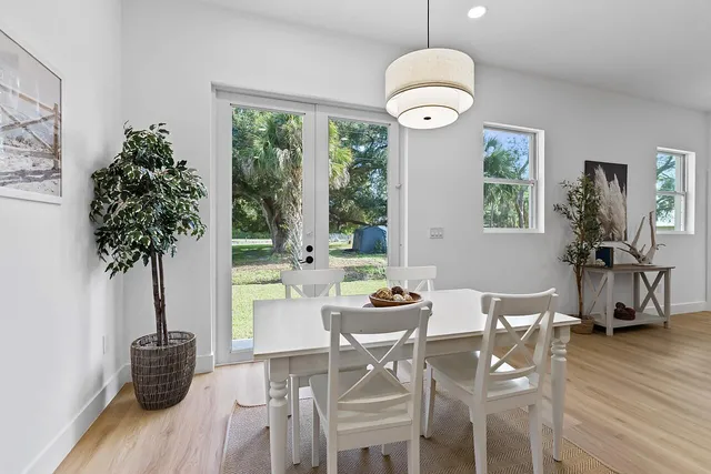 a view of a dining room with furniture window and wooden floor